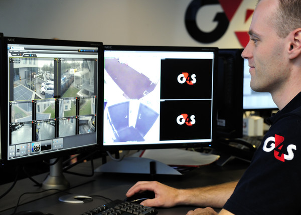 G4S security professional in front of monitors
