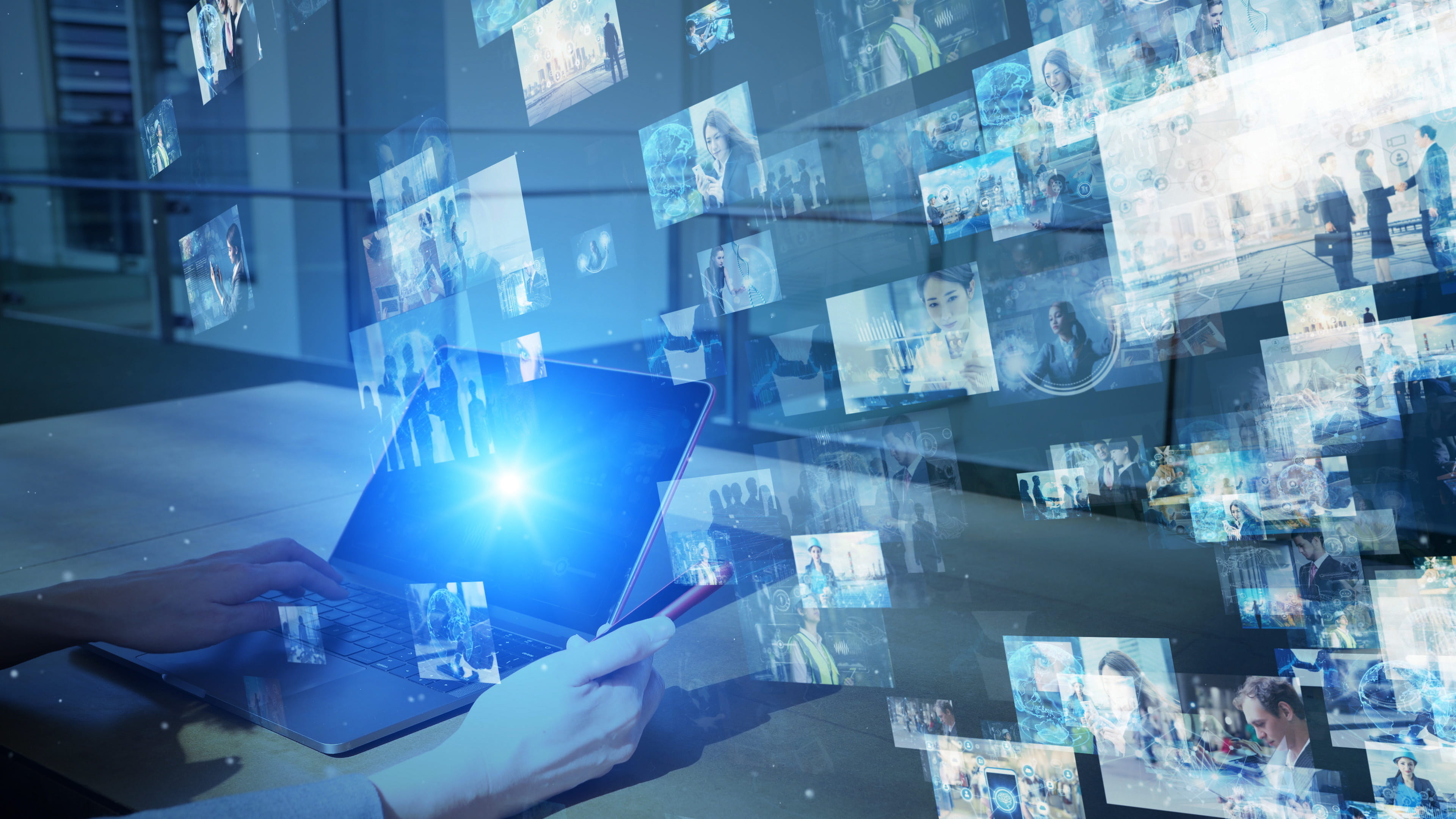 A user holding a tablet with images floating in the air virtually