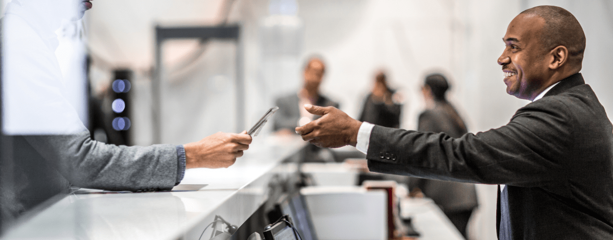 Security professional granting access for a visitor