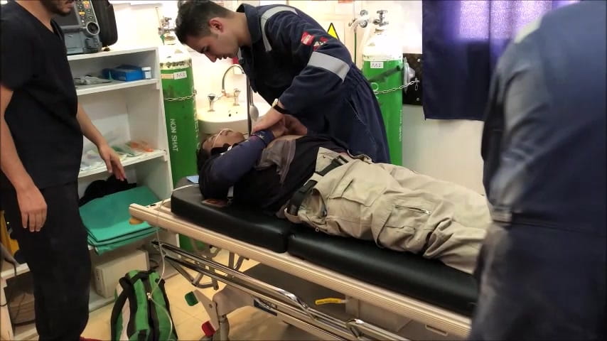 Healthcare staff caring for a patient