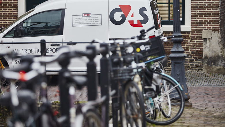 Bikes in front of a G4S security van