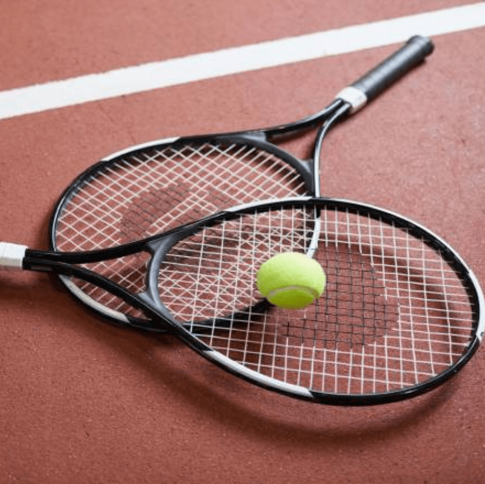 Tennis rackets and a tennis ball