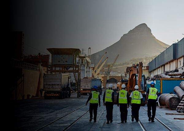 5 G4S workers walking towards the construction working area