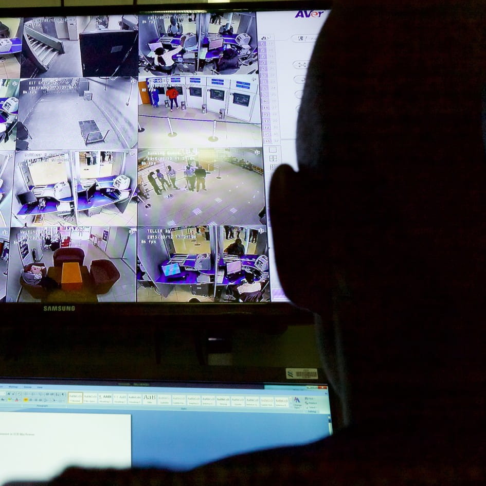Security officer monitoring CCTV in a control room