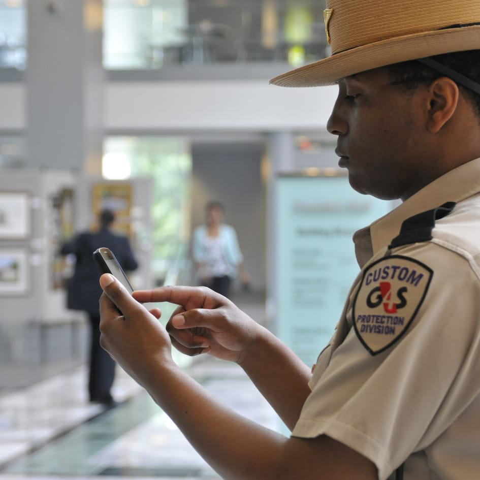 Security guard on mobile phone