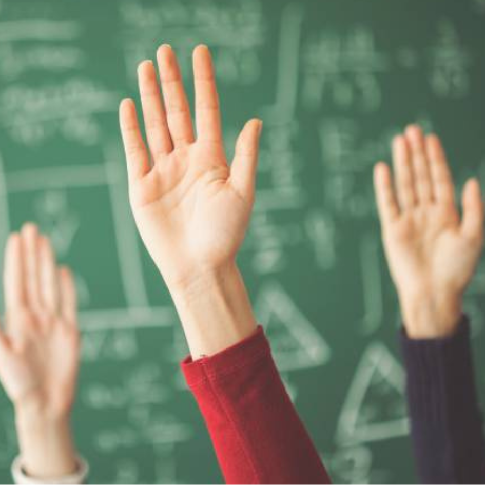 Raising hands in front of the blackboard