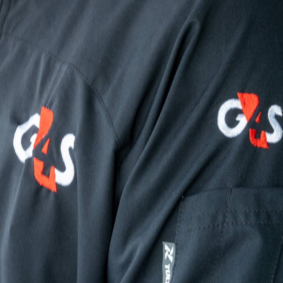 Close up of G4S logo in uniform 
