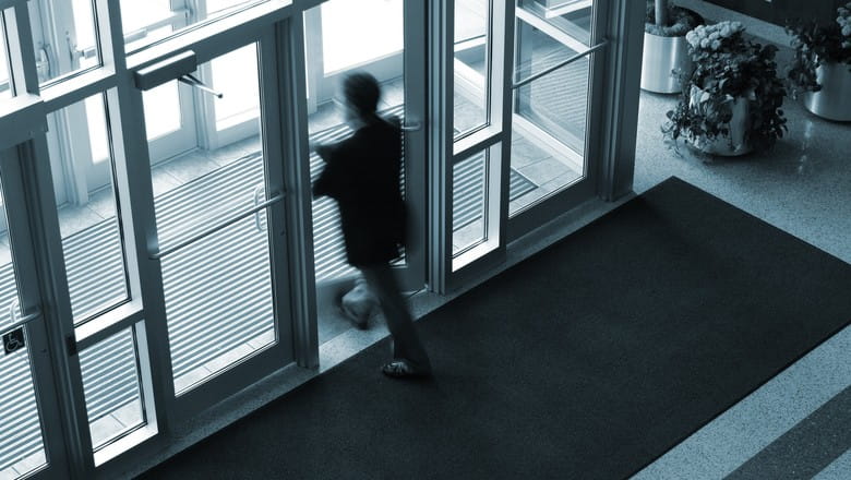 A man existing a building