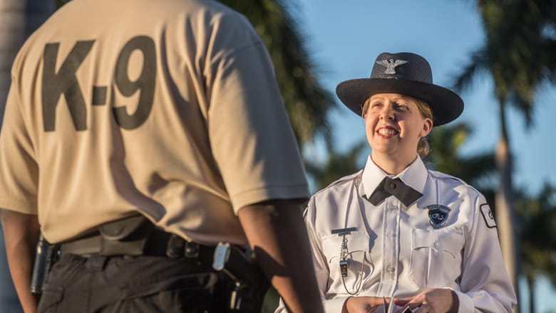 G4S security guard on patrol with canine (K9) support team