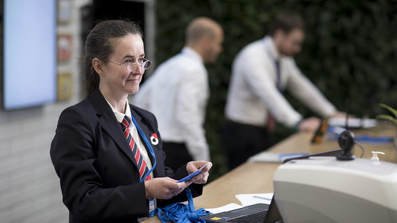  A G4S employee at NHS Nightingale distributing patches