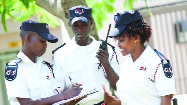 Security guards on duty discussing in a circle