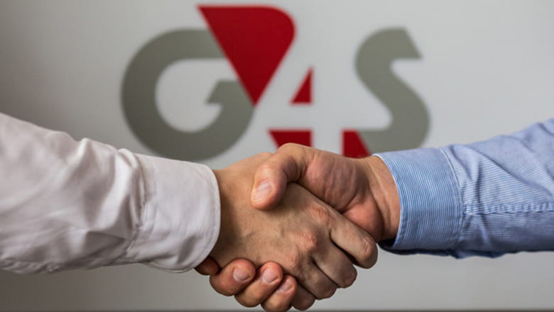 Handshake with G4S logo in the background