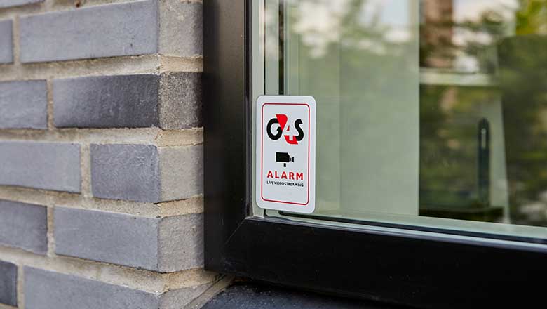 Alarmskilt på vindue