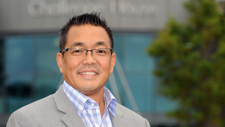 G4S executive in light grey suit smiling