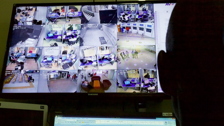 monitoring security cameras on computer screen
