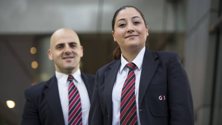 male and female G4S staff members wearing uniform and working at Australia Courts
