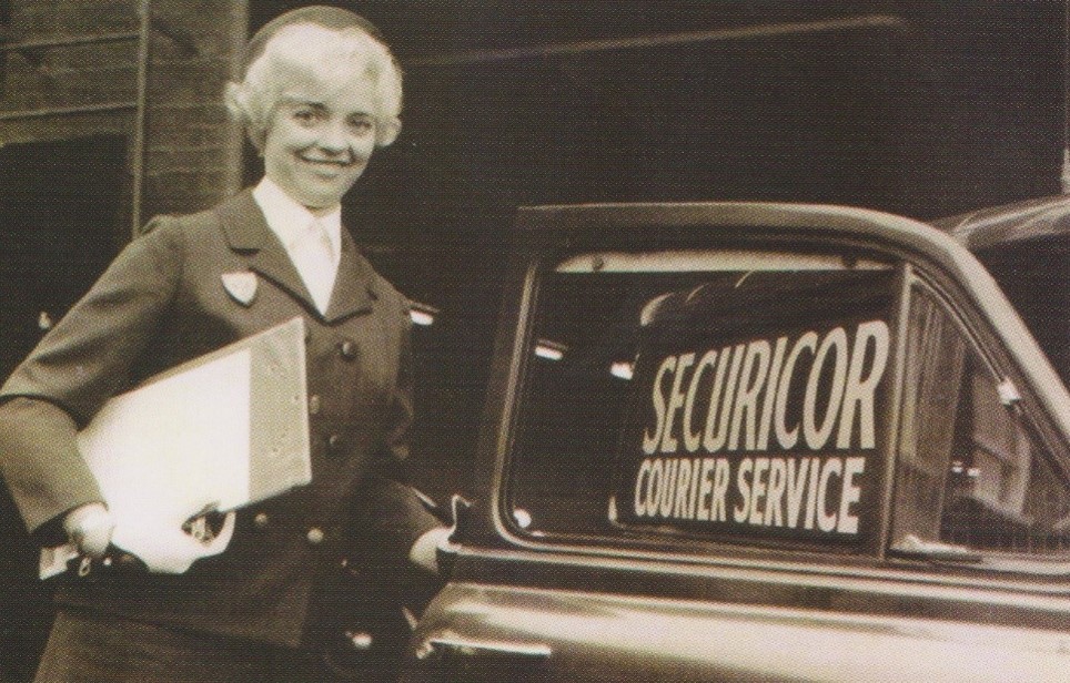 Securicor Courier Service car and a woman in the 60s