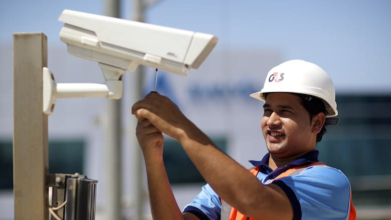 Man with security camera