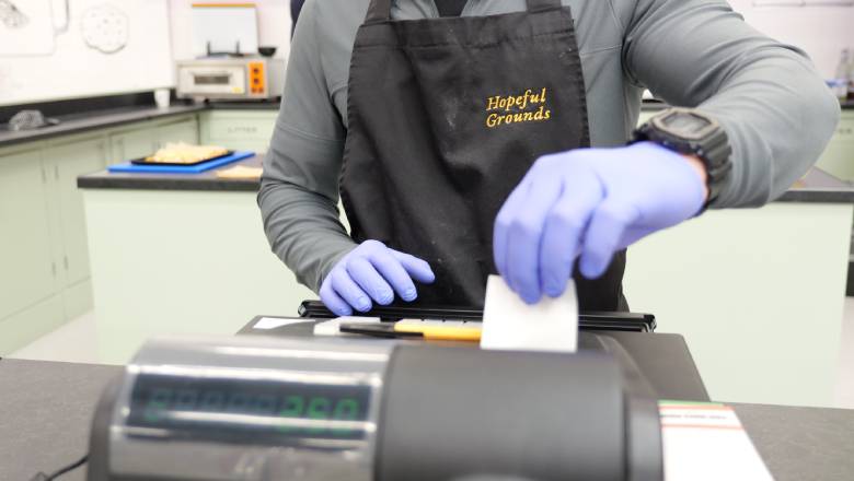 Person handling receipt near cashier machine