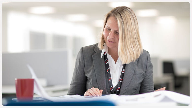 G4S employee reading papers