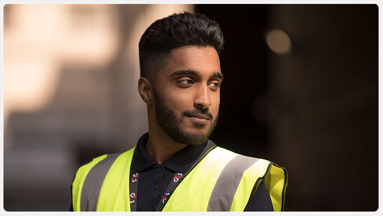G4S employee wearing a yellow vest