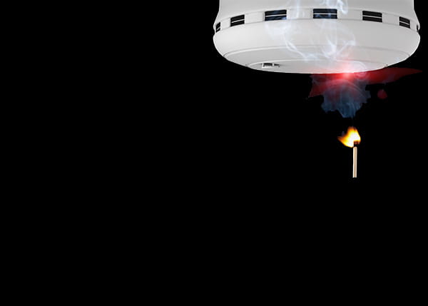 Fire detection machine with a match on fire and smoke