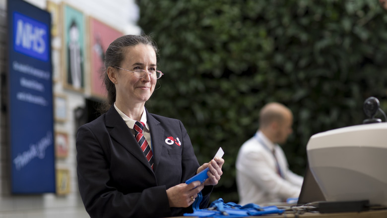 G4S Security Officer handing out ID badges at NHS Nightingale