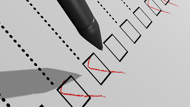 red tick in a black box on a piece of paper