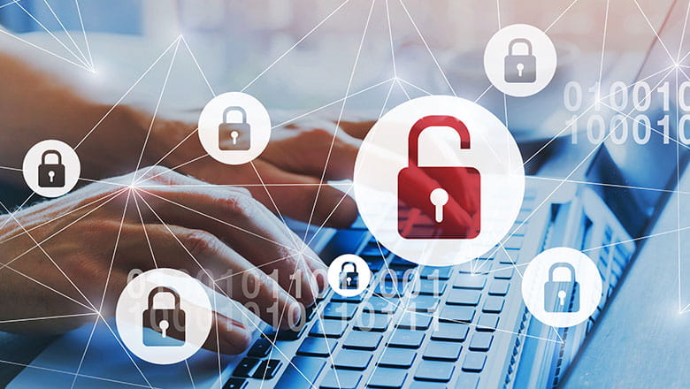Someone typing on a laptop with virtual lock icons floating in front of it