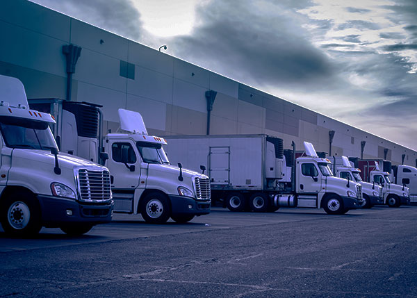 Lorries parked outside of a factory