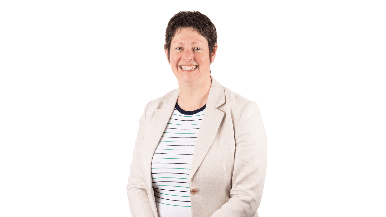 G4S Executive women wearing on light blue suit with reflection in office window