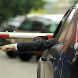 Car at security boom gate