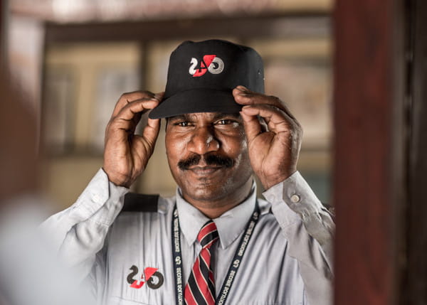 G4S employee wearing hat India