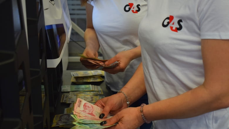 G4S employees handling cash