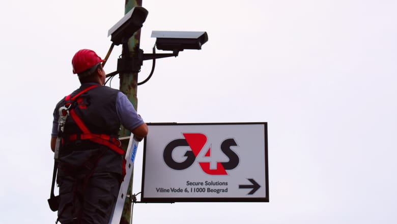 G4S employee installing security systems