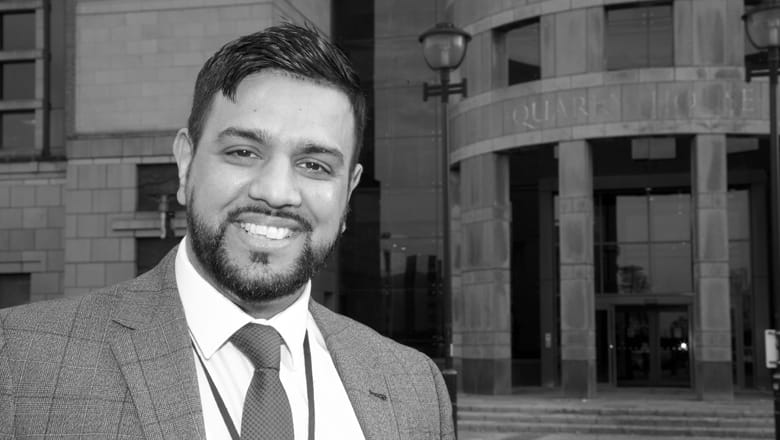 G4S employee wearing a suit