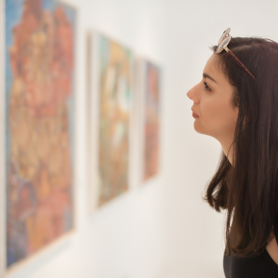 Woman looking at a painting