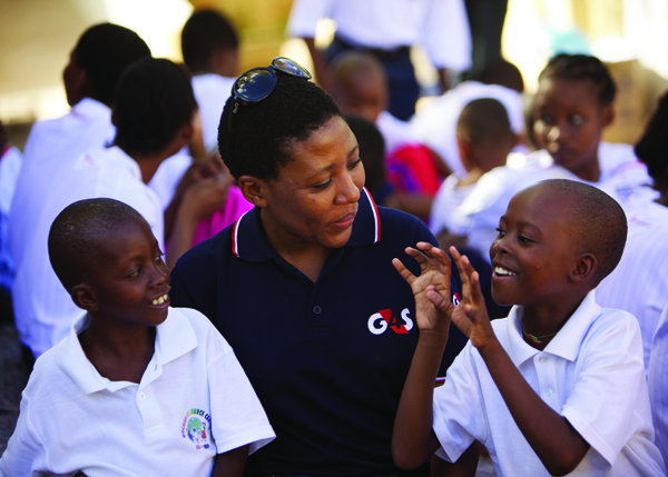 G4S staff taking care of children