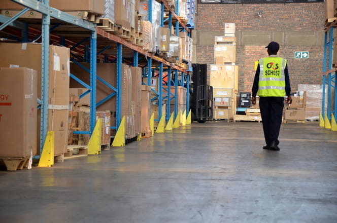 Security Officer patrolling in warehouse