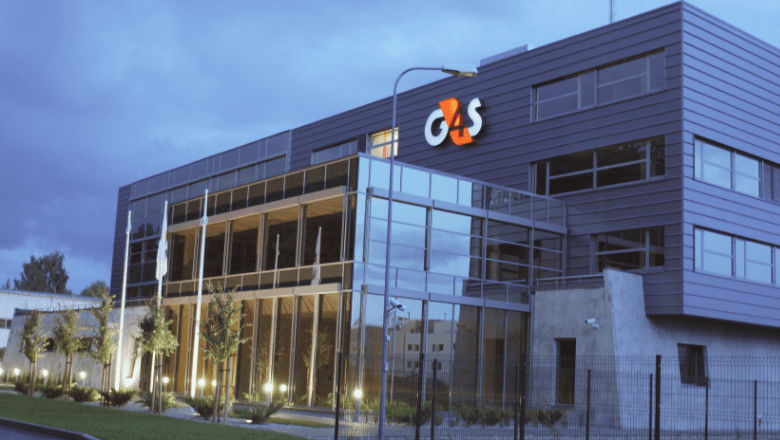 Stiklota ēka ar lielu G4S logo uz fasādes. 