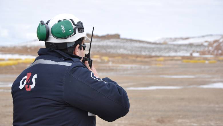 G4S security officer looking out onto a mine